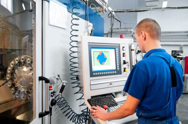 Operator working a cnc lathe machine